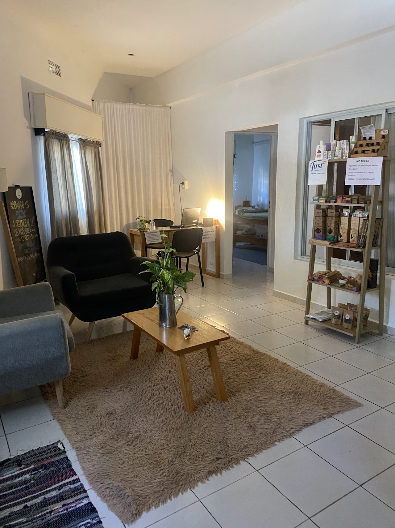 Peaceful wellness massage session detail, hands applying natural warm aromatic oils on back or neck with smooth hot stones, eucalyptus leaves, soft bokeh, gentle warm terracotta and sage green ambient tones, aesthetic spa treatment photography.