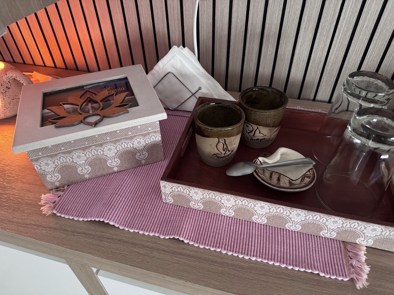Peaceful wellness massage session detail, hands applying natural warm aromatic oils on back or neck with smooth hot stones, eucalyptus leaves, soft bokeh, gentle warm terracotta and sage green ambient tones, aesthetic spa treatment photography.